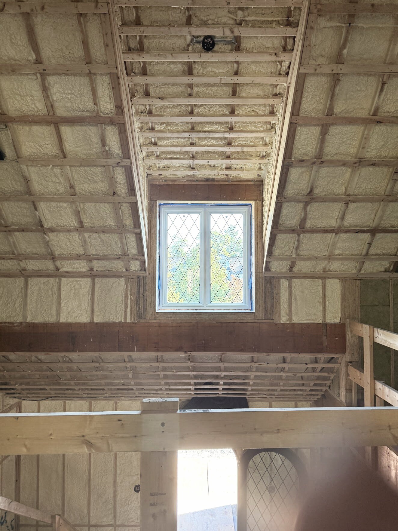 Roof framing around a leaded glass window