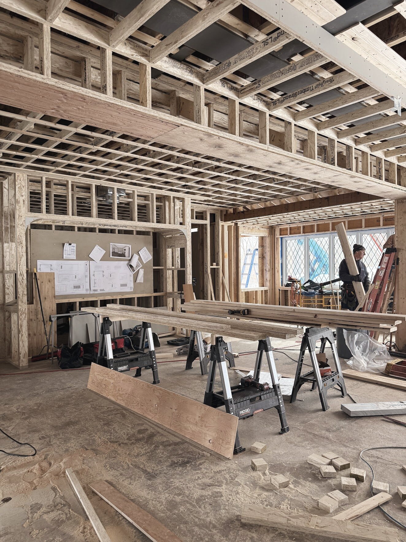 An interior at framing stage with sawhorses set up